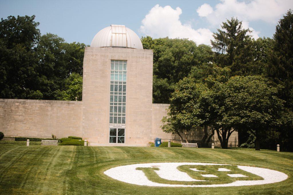 Holcomb Observatory with BU in white on the lawn